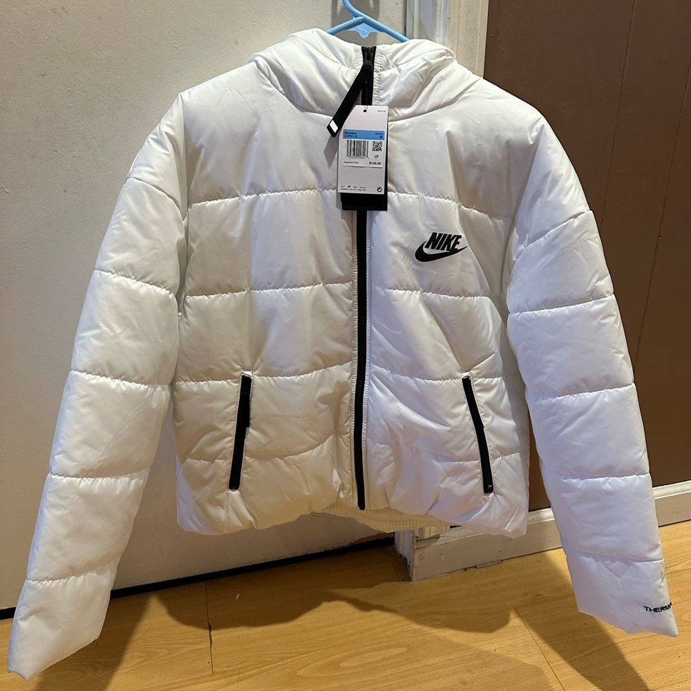 Women’s white Nike puffer jacket